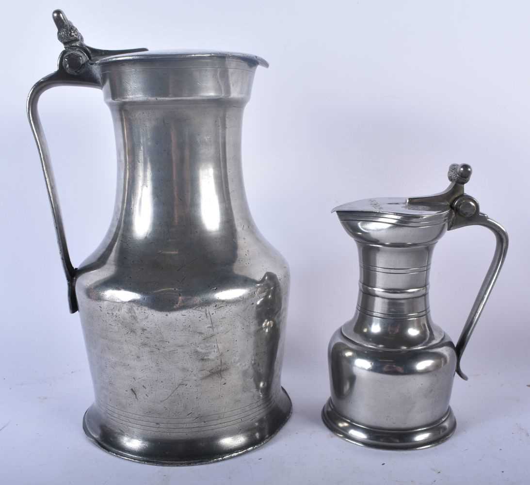 TWO PEWTER FLAGONS together with a bronze desk stand. Largest 30cm x 22 cm. (3) - Image 4 of 9