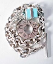 A Tiffany Silver Charm Bracelet with a Gift Box Charm. Stamped Tiffany 925, 21cm long, weight 38.7g