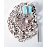 A Tiffany Silver Charm Bracelet with a Gift Box Charm. Stamped Tiffany 925, 21cm long, weight 38.7g