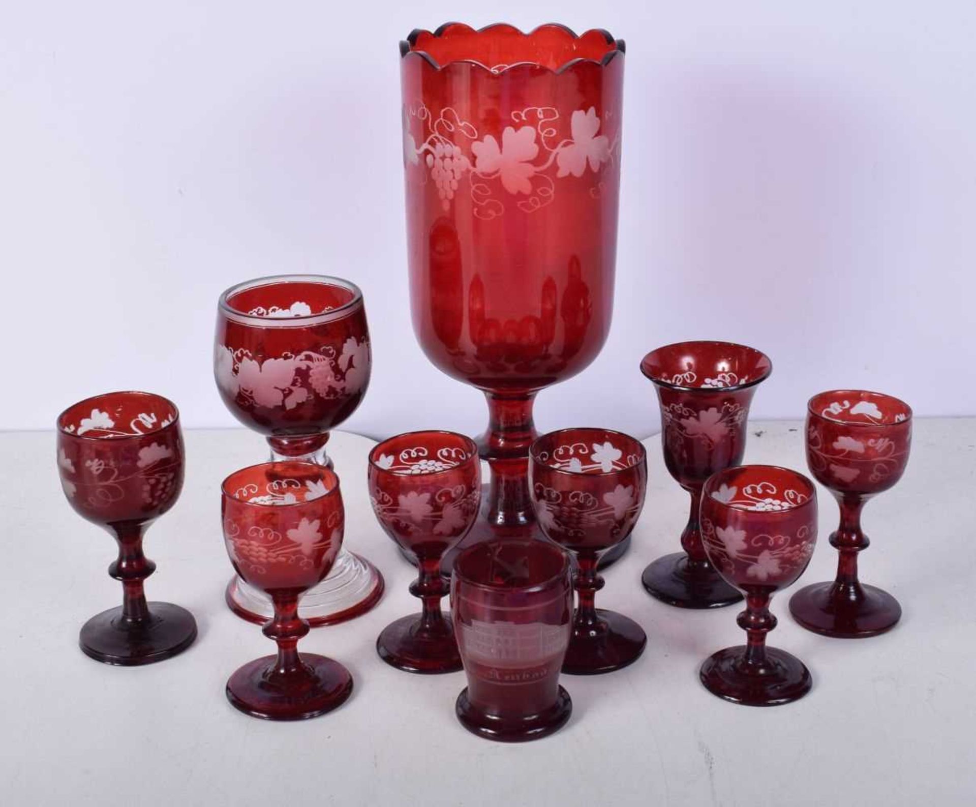 A collection of 1950's Bohemian Ruby wine glasses engraved with a Floral pattern together with a - Image 2 of 8