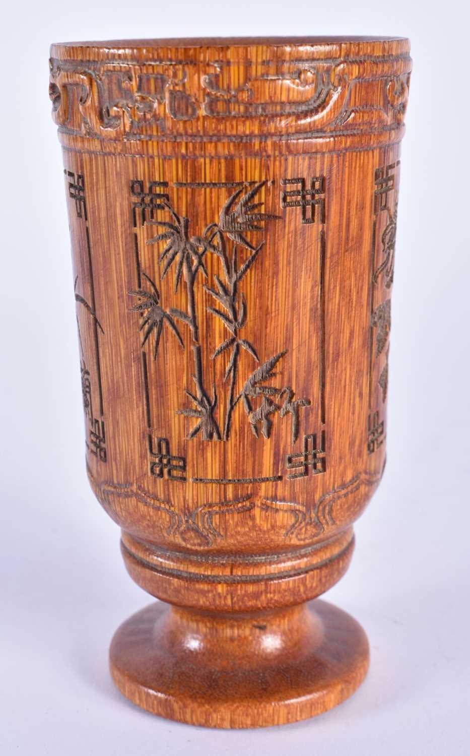 A CHINESE CARVED BUFFALO HORN TYPE BEAKER VASE 20th Century. 257 grams. 12 cm high.