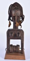 A TRIBAL CARVED WOOD AFRICAN PULLEY. 24 cm high.