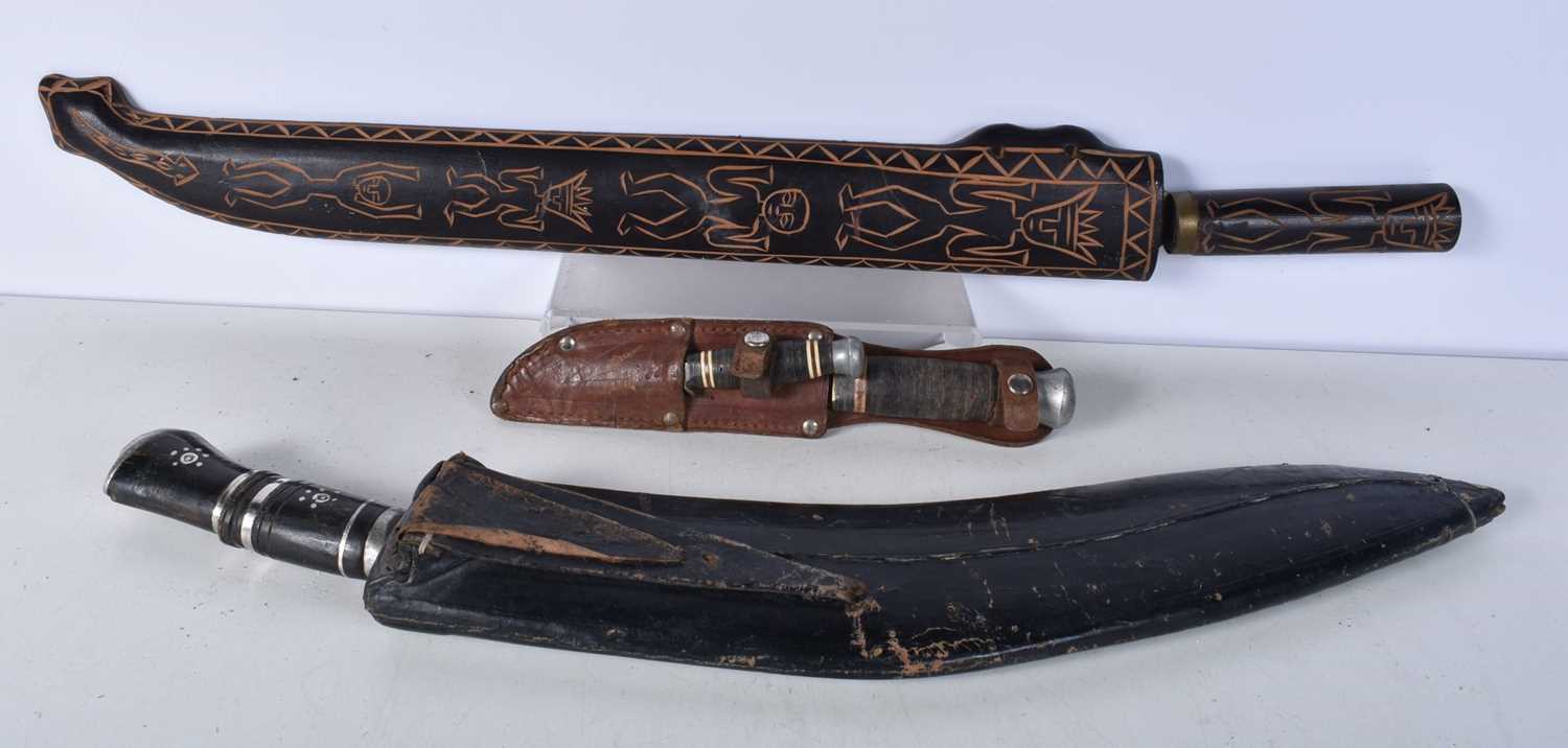 A large Indian Kukri with leather sheath together with a large South American knife with a carved - Image 2 of 12