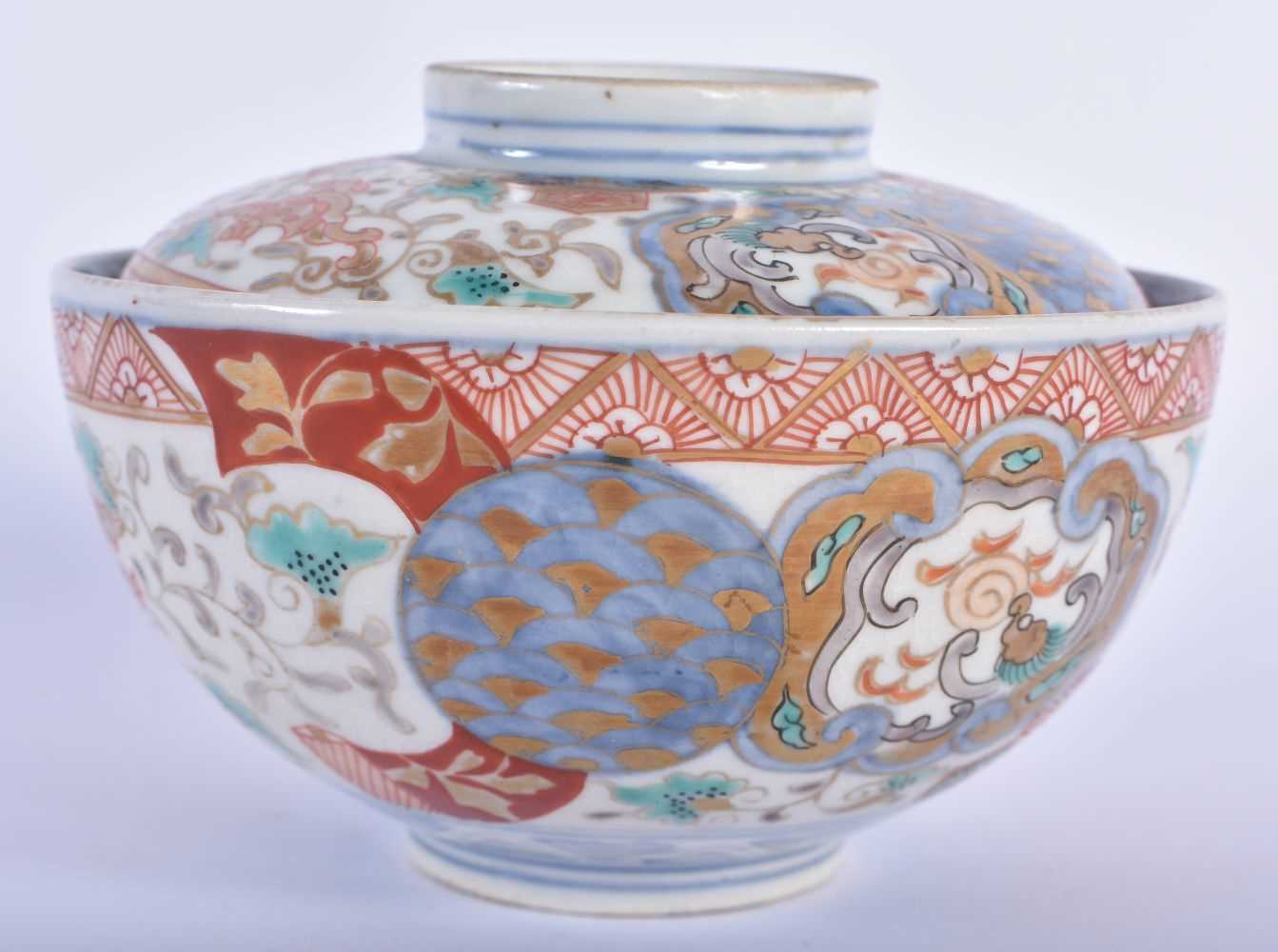 A 19TH CENTURY JAPANESE MEIJI PERIOD IMARI BOWL AND COVER painted with beasts and foliage. 10 cm
