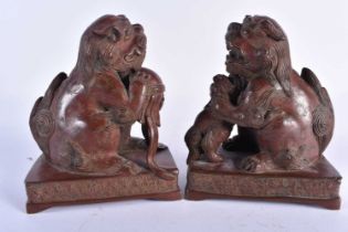 A PAIR OF 19TH CENTURY CHINESE BRONZE DOG OF FOE BOOK ENDS Qing. Each 18cm x 13 cm.