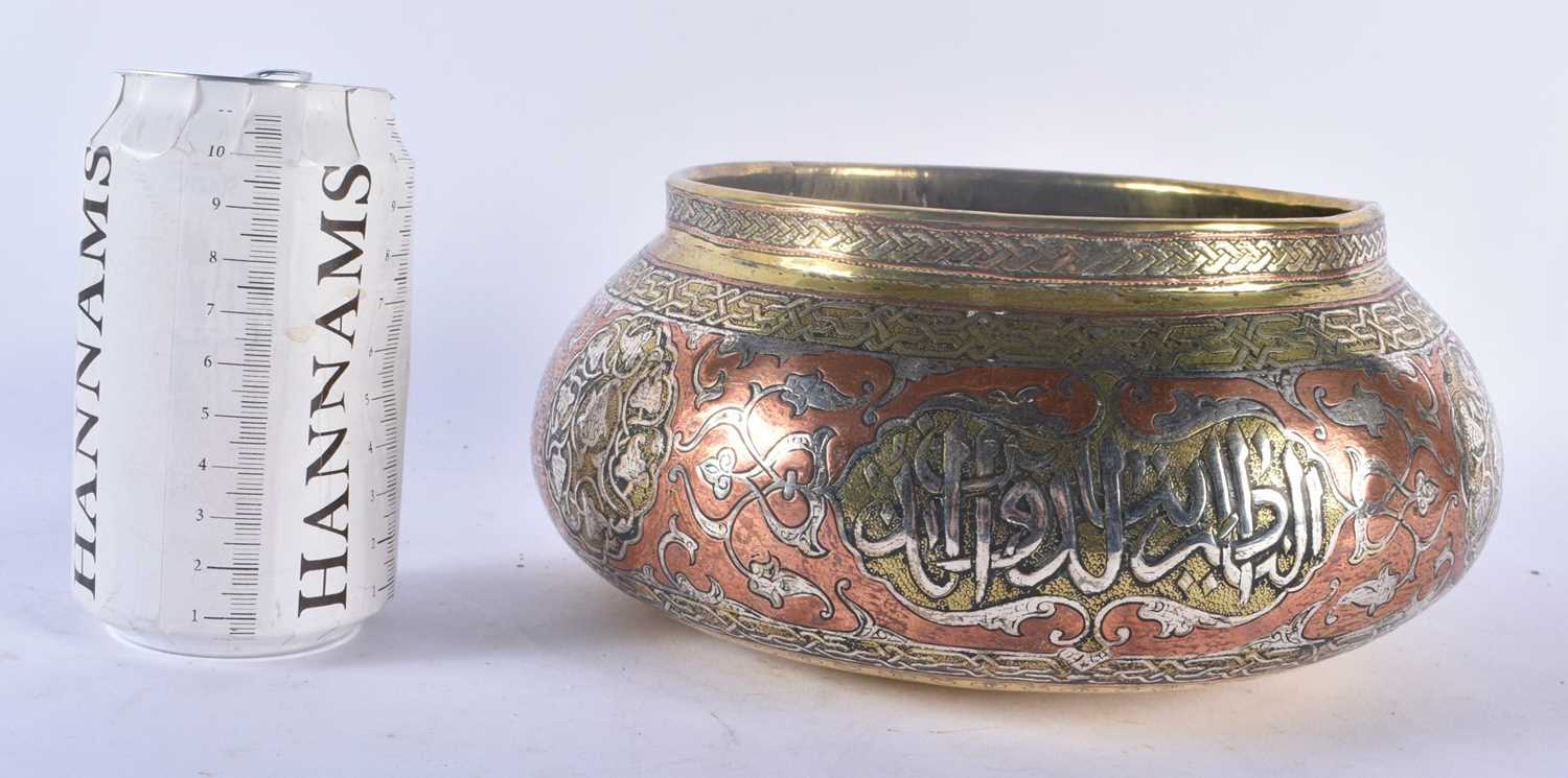 A 19TH CENTURY MIDDLE EASTERN SILVER INLAID MAMLUK BRONZE CENSER decorated with calligraphy and