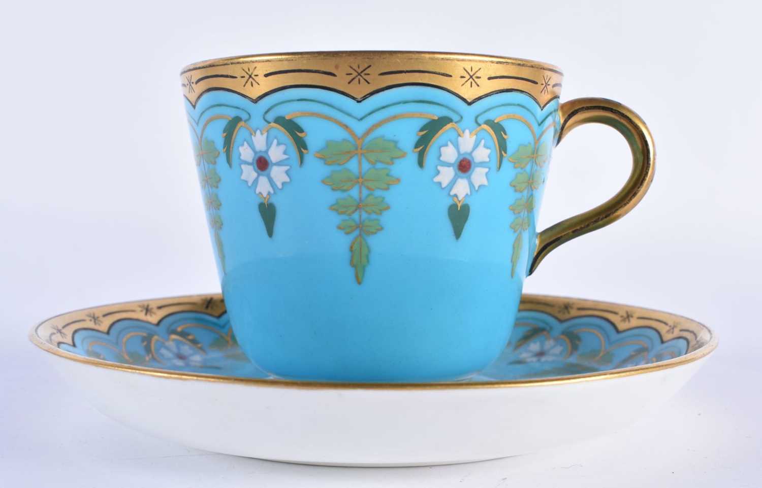 Minton cup and saucer with turquoise ground with raised white flowers and green leaves in the