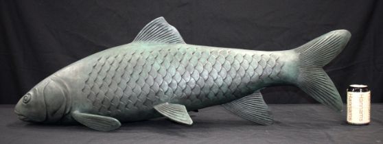 A huge bronze fish 102 x 33 cm .