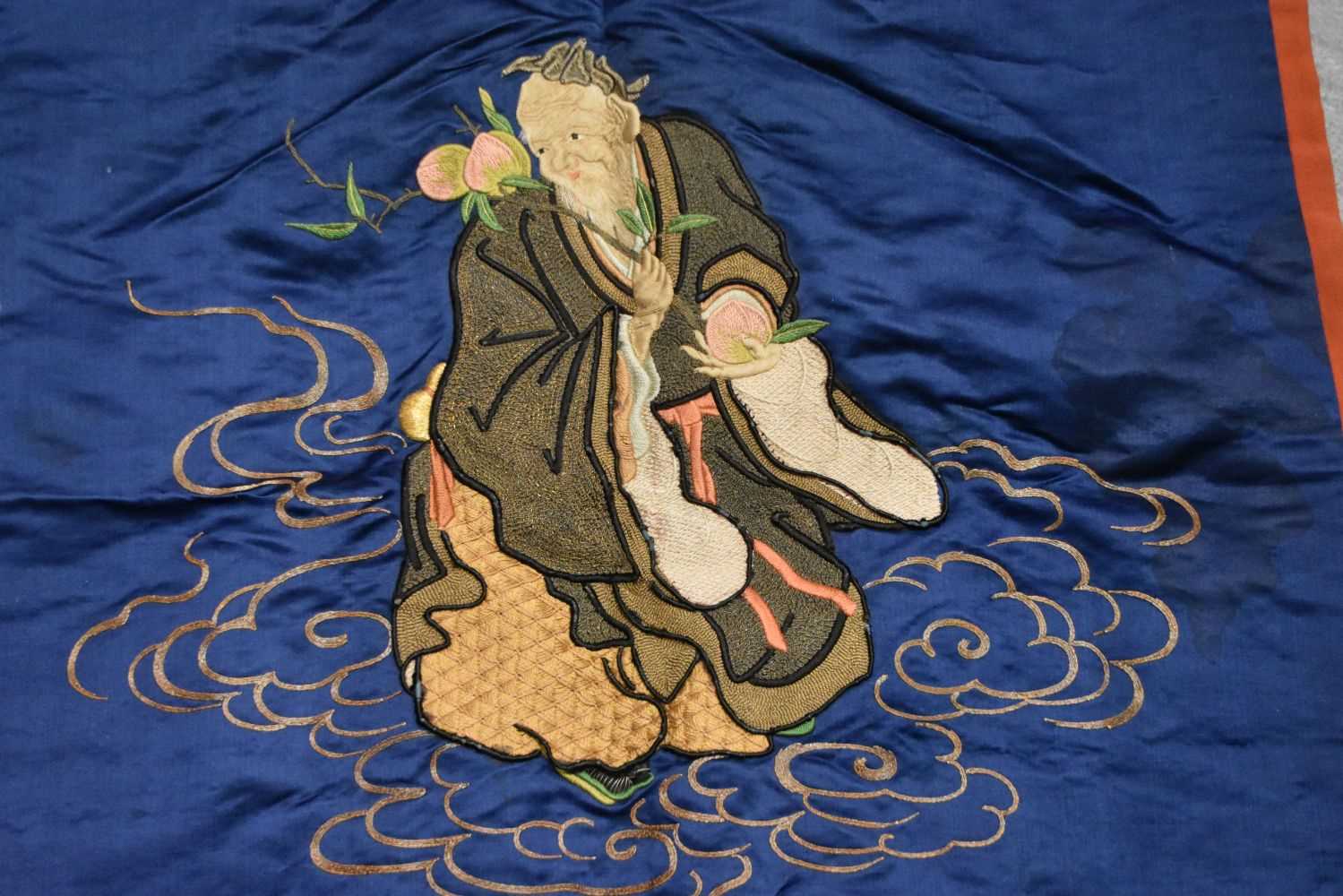 A Chinese Silk Panel of a Sage Holding a Peach Blossom. 68cm x 71cm - Image 2 of 2