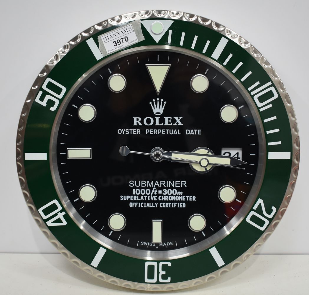 A Contemporary Rolex style dealership clock 33 cm.