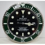 A Contemporary Rolex style dealership clock 33 cm.