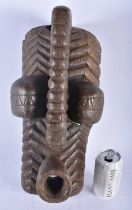 A LARGE AFRICAN TRIBAL CARVED WOOD MASK. 45cm x 15 cm.