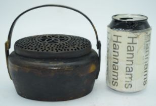 A Chinese Qing Dynasty bronze hand warmer 8 x 15 x 12 cm.