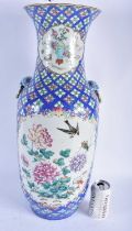 A LARGE 19TH CENTURY CHINESE FAMILLE ROSE PORCELAIN VASE Qing, painted with locusts and flowers.