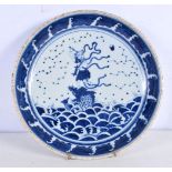 A Chinese Porcelain blue and white dish decorative with a figure riding ab fish 6 x 29 cm.