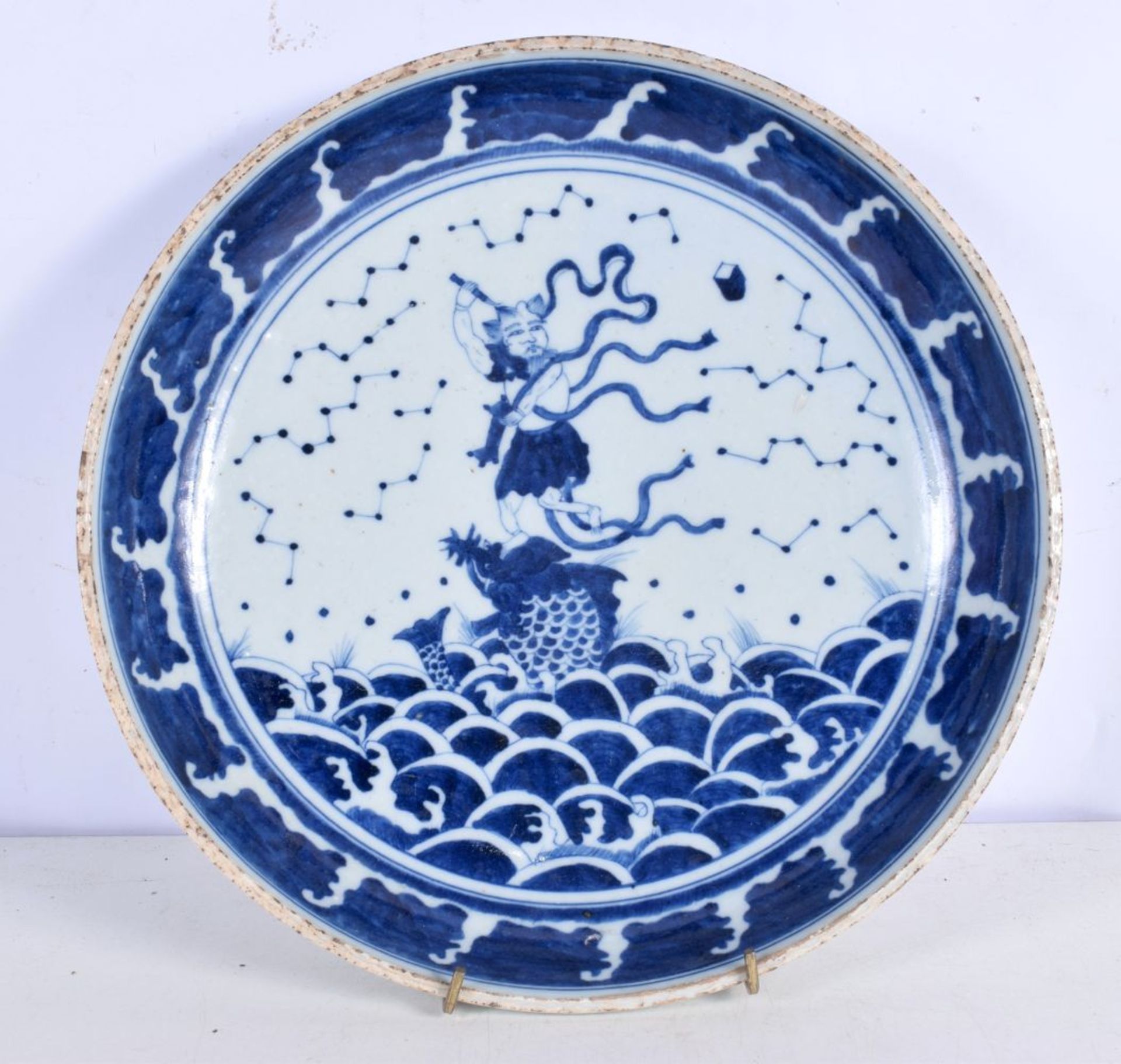 A Chinese Porcelain blue and white dish decorative with a figure riding ab fish 6 x 29 cm.