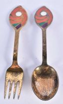 A SILVER AND ENAMEL FORK AND SPOON. 93 grams. 16 cm long.