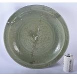 A LARGE 16TH/17TH CENTURY King CELADON INCISED CHARGER decorated with foliage. 44 cm diameter.