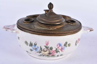 A 19TH CENTURY FRENCH TIN GLAZED POTTERY INKWELL painted with flowers. 14.5 cm wide.