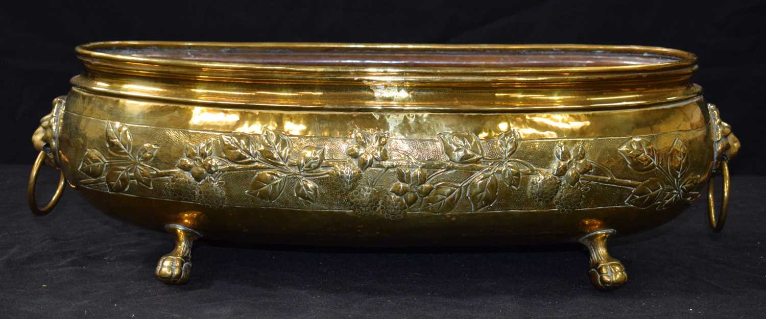 An antique repousse brass planter 19 x 58 cm. - Image 4 of 8