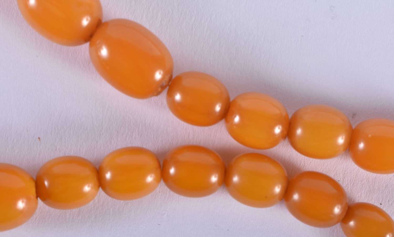 FOUR VINTAGE AMBER TYPE NECKLACES. 183 grams. Largest 88 cm long. (4) - Image 5 of 5