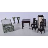 A Chinese miniature hardwood table and chairs with mother of pearl inlay together with a pair of