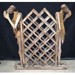 A large Tiki art wooden wine rack 103 x 92 cm.
