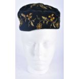 AN ANTIQUE EMBROIDERED VELVET SMOKERS CAP. 18cm wide.