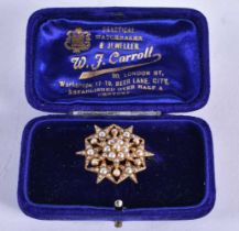 AN ANTIQUE 15CT GOLD AND PEARL BROOCH. 6.6 grams. 2.5 cm x 2.75 cm.