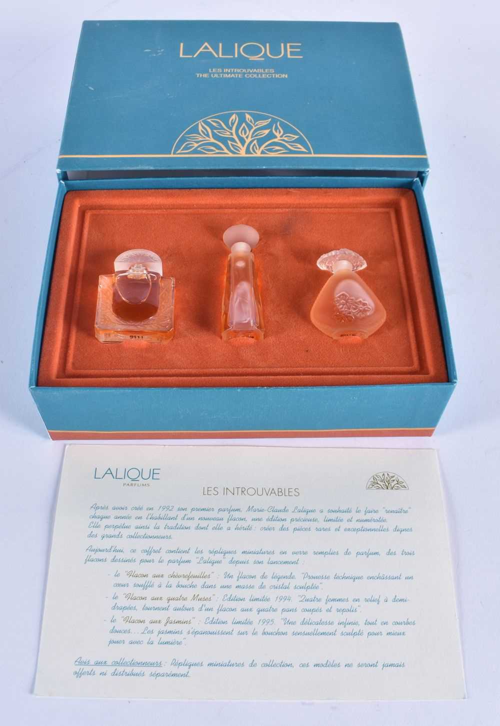 A BOXED FRENCH LALIQUE GLASS SCENT BOTTLE SET. Box 18cm x 12 cm.