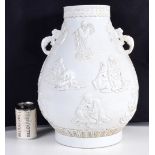 A large Chinese white glazed soft paste twin handled pot decorative in relief with Immortals 46 cm