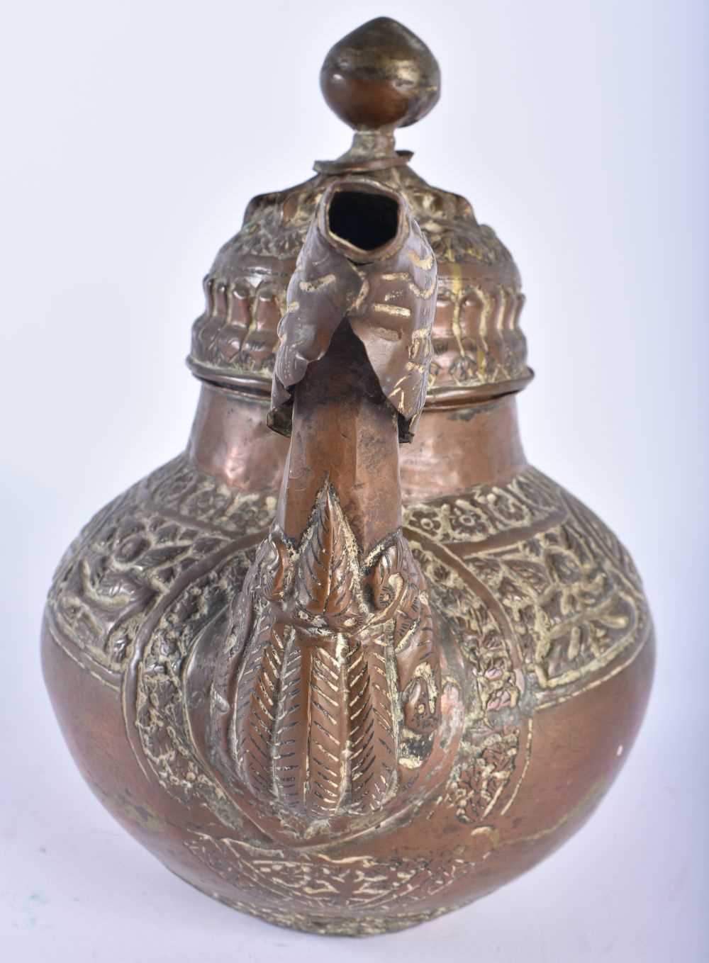 A 19TH CENTURY TIBETAN COPPER TEAPOT AND COVER decorated with repousse figures and foliage. 23 cm - Image 2 of 5