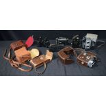 A collection of cased Vintage Cameras together with a cased pair of Binoculars (6).