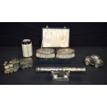 A pair of cased silver plate brushes together with a quantity of plated Christening ware largest 6.