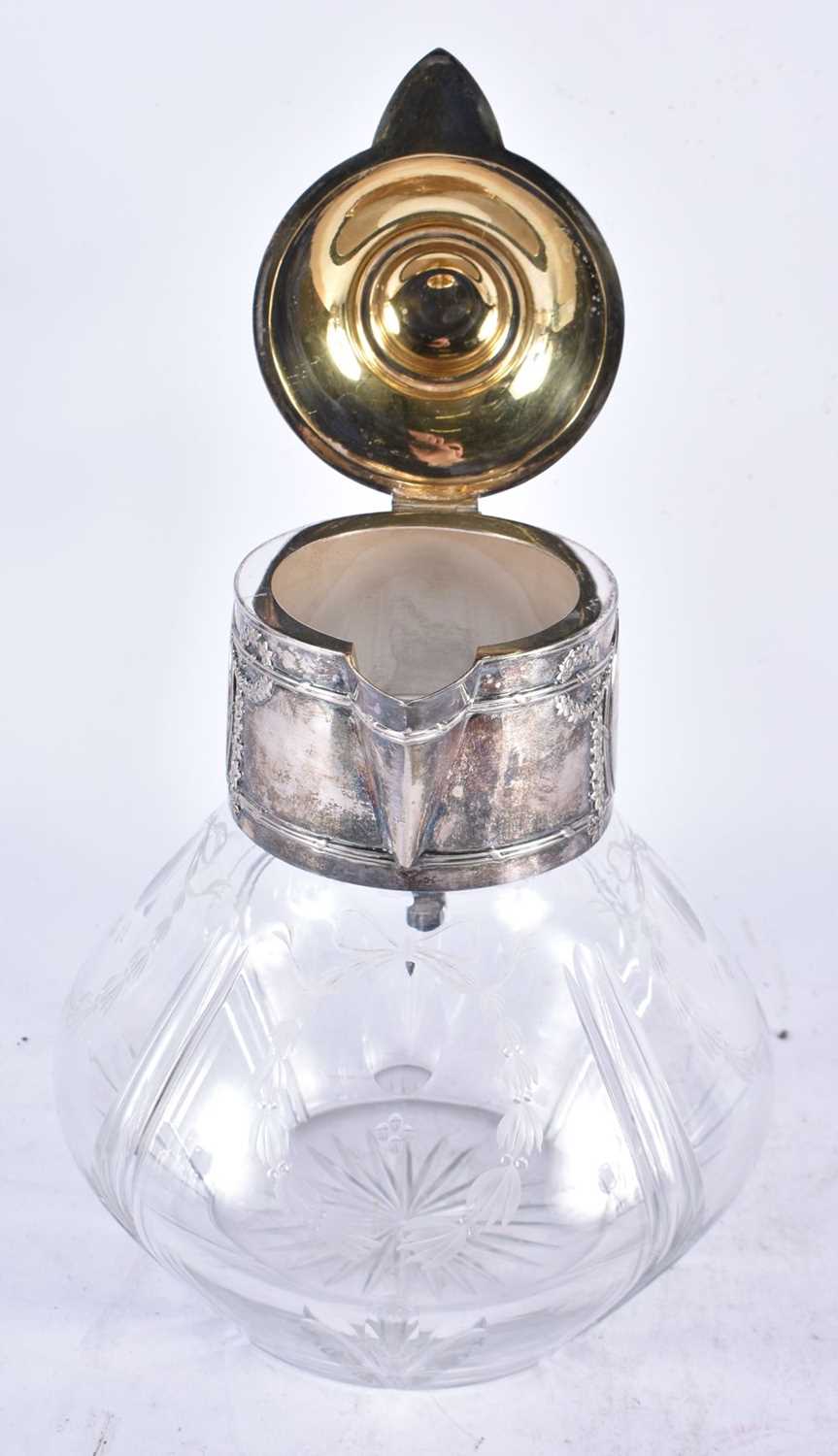 A LARGE EARLY 20TH CENTURY CONTINENTAL SILVER AND CUT GLASS CLARET JUG. 26cm x 18cm. - Image 2 of 3