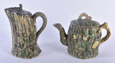 A VICTORIAN MAJOLICA TEAPOT AND COVER together with a matching pewter mounted jug. Largest 20 cm x