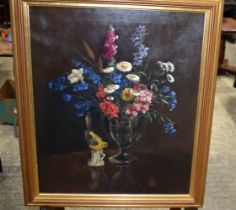 A framed 20th Century Still life of flowers oil on Canvas possibly signed T, 57 x 48 cm.