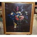 A framed 20th Century Still life of flowers oil on Canvas possibly signed T, 57 x 48 cm.