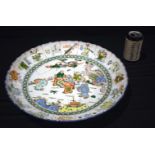 A large 20th Century porcelain Famille Verte charger decorative with figurers 7 x 41 cm.