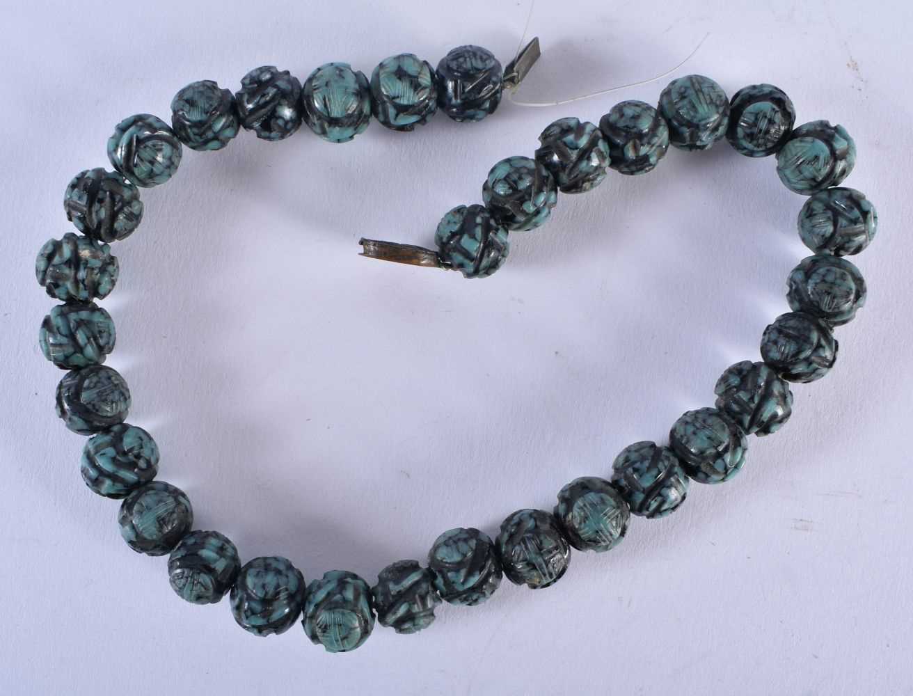 A 19TH CENTURY CHINESE CARVED TURQUOISE NECKLACE Qing. 73 grams. 34 cm long.