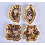 Coalport set of small shaped trays with gold ground painted in Japanese style with prunus blossom.