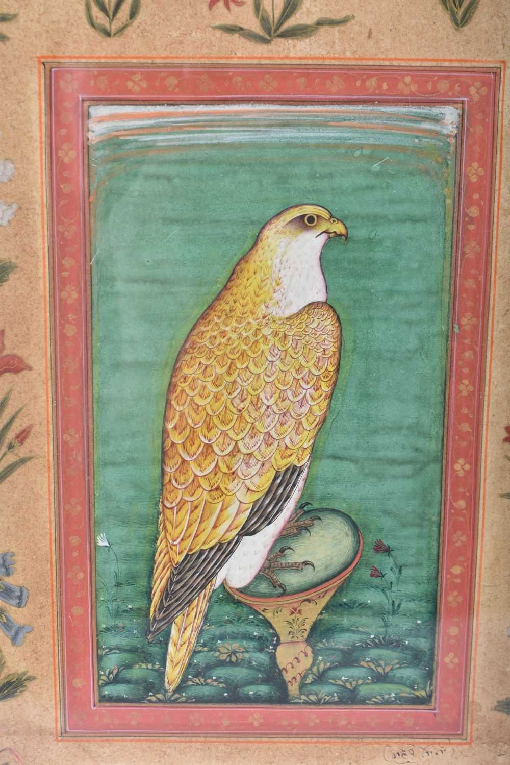 A 19TH CENTURY PERSIAN ISLAMIC ILLUMINATED WATERCOLOUR painted with a hawk flanked by foliage. 38 cm - Image 2 of 5