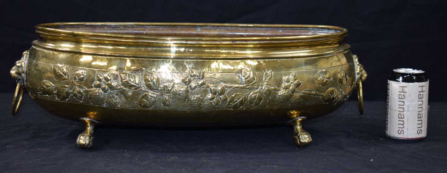An antique repousse brass planter 19 x 58 cm. - Image 2 of 8