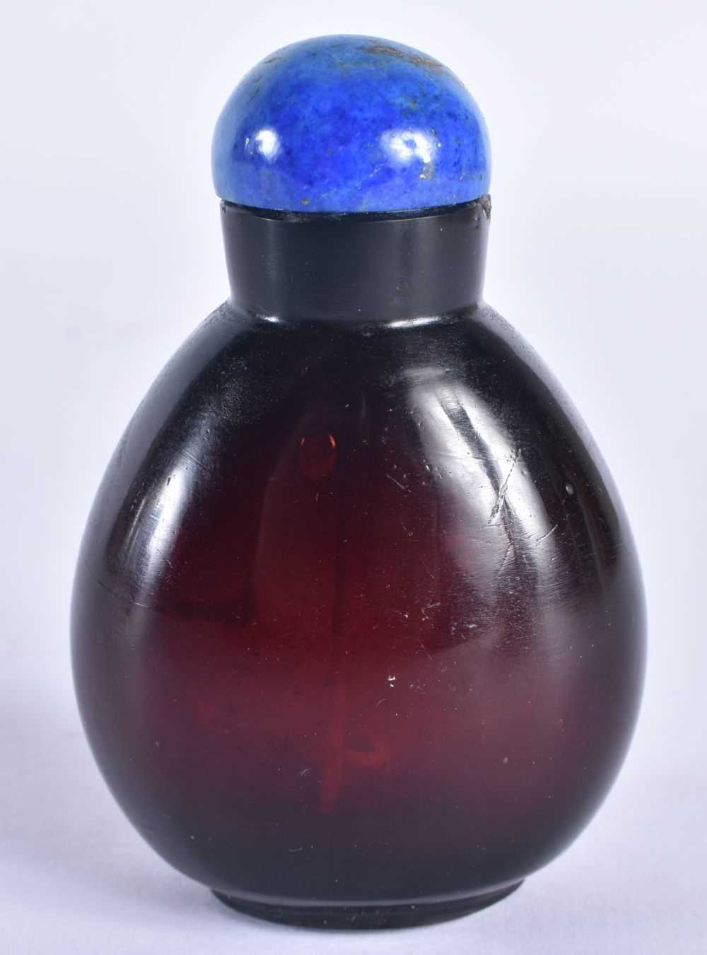 A 19TH CENTURY CHINESE CHERRY AMBER GLASS SNUFF BOTTLE AND STOPPER Qing. 8 cm x 5 cm.