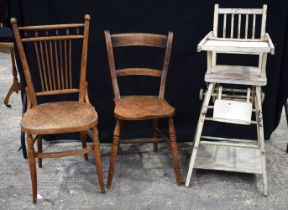 An antique Farmhouse wooden scroll back chair together another chair and a Metamorphic childs high