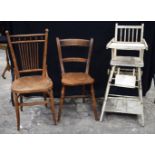 An antique Farmhouse wooden scroll back chair together another chair and a Metamorphic childs high