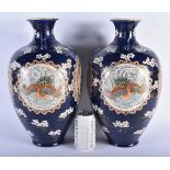 A LARGE PAIR OF LATE 19TH CENTURY JAPANESE MEIJI PERIOD SATSUMA VASES painted in relief with