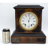A wooden Mid Century mantle clock with metal enamelled face 53 x 29 x 15 cm.
