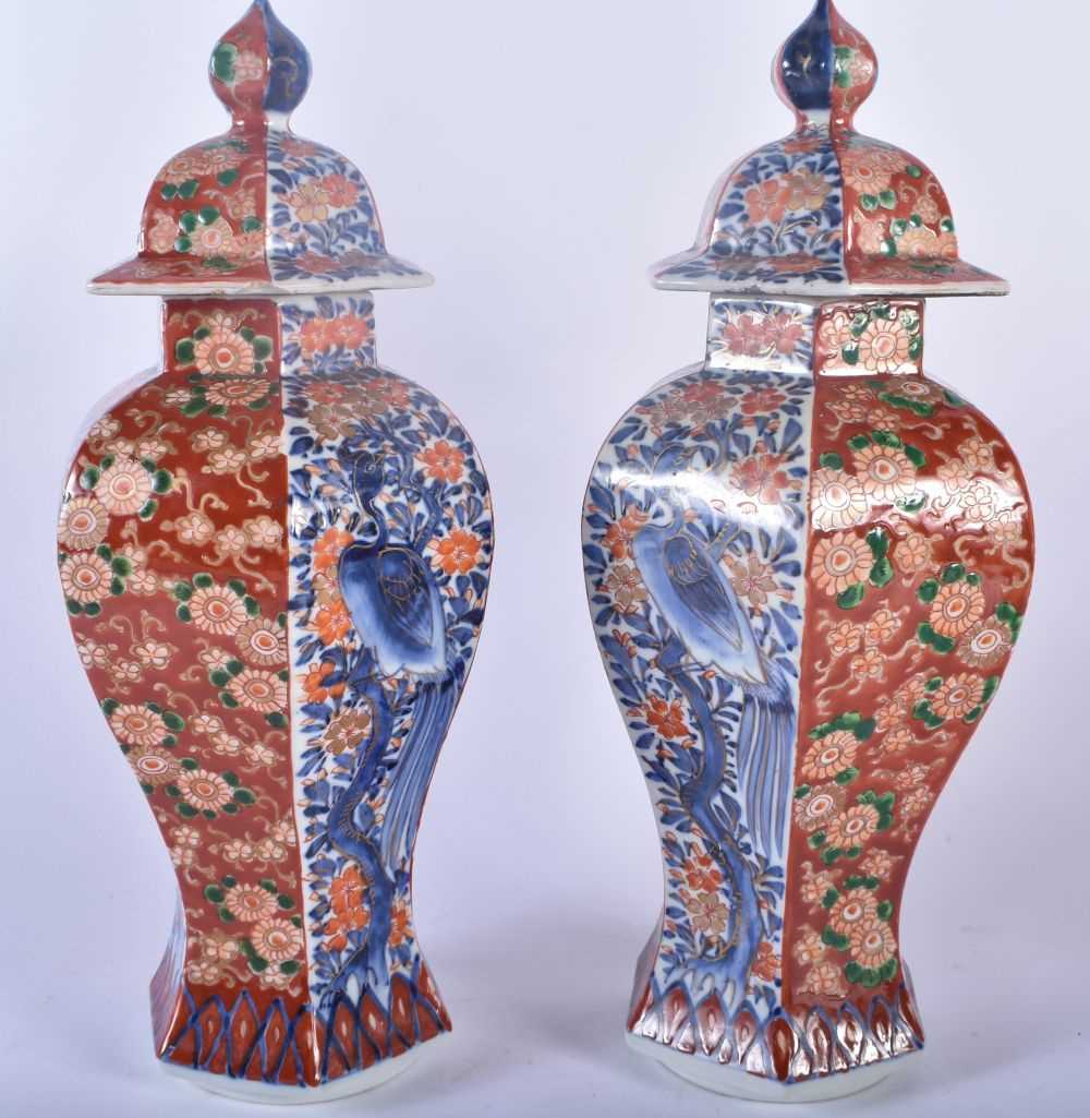 A PAIR OF 19TH CENTURY JAPANESE MEIJI PERIOD IMARI VASES AND COVERS painted with flowers, birds - Image 3 of 5