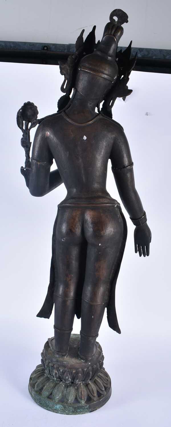 A LARGE 19TH CENTURY INDIAN TIBETAN BRONZE FIGURE OF A STANDING DEITY modelled upon a leaf form - Image 7 of 8